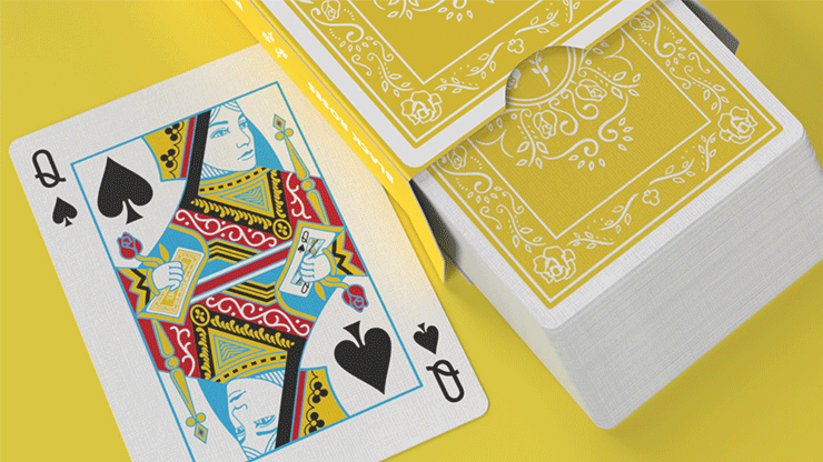 Black Roses Sunny Days playing cards showing yellow floral card backs beside the Queen of Spades